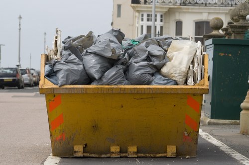 Construction site with builders clearing waste