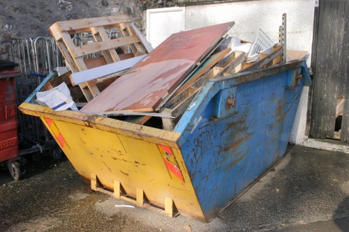 Garden debris being removed by a clearance team